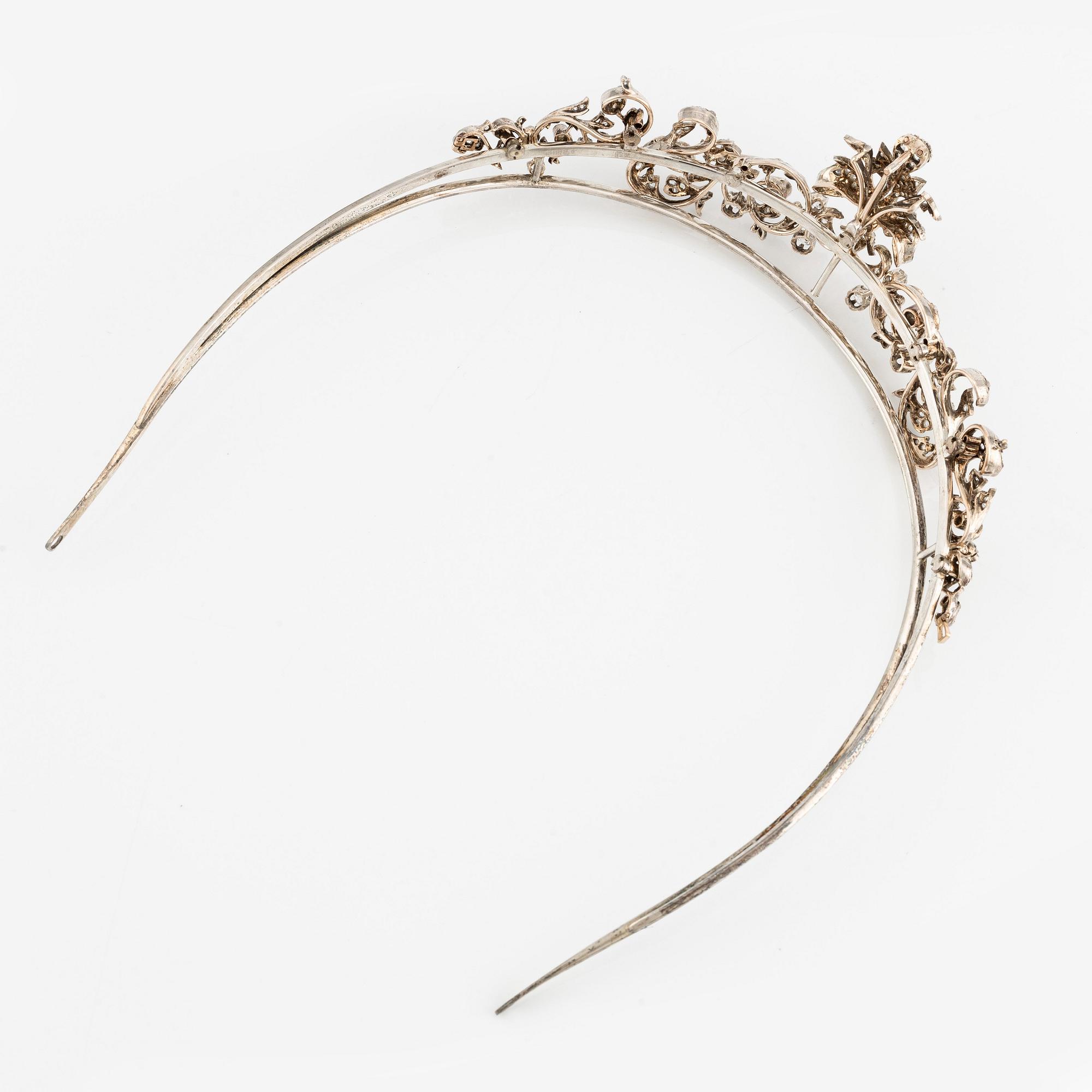 An 18K gold and silver tiara composed of scroll motifs set