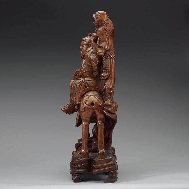 A large wooden sculpture group of Guandi on horseback and an attendant, Qing dynasty (1644-1912).