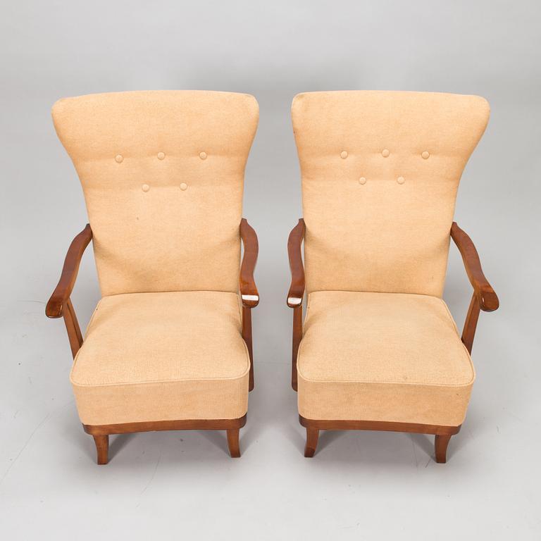 A pair of 1950s armchairs.