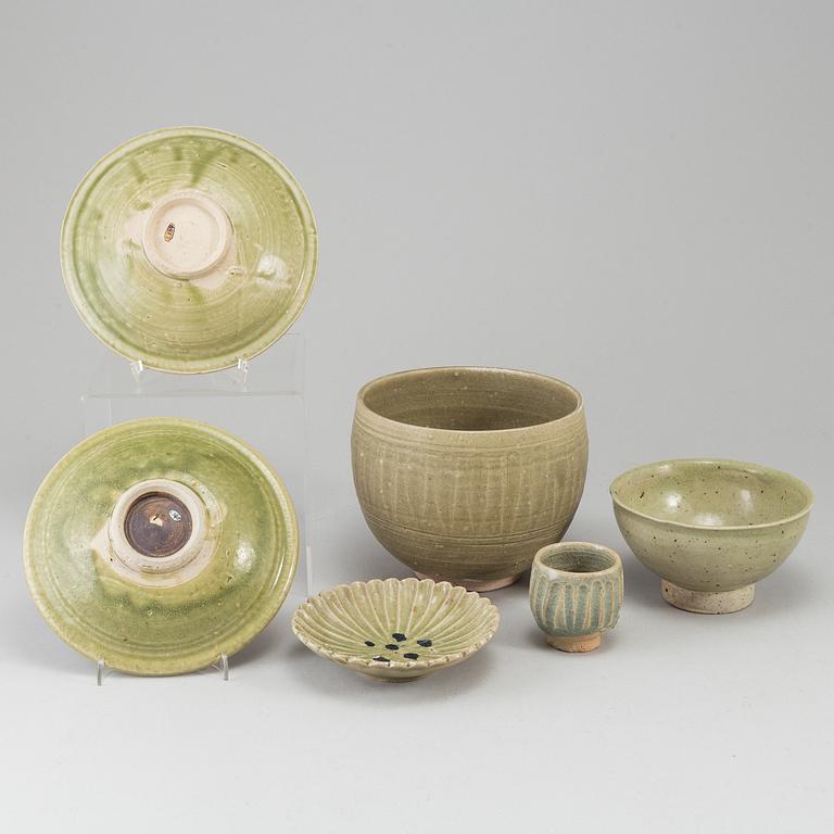 A group of olive green glazed bowls, South East Asia, 20th Century. (6 pieces).