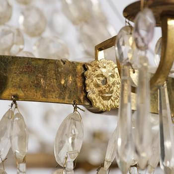 A Swedish gilt brass and cut glass thirteen-light Empire chandelier, early 19th century.