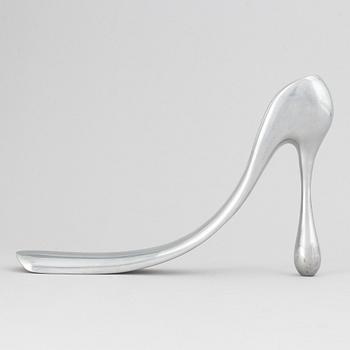 Manolo Blahnik, a metal shoe horn, 21st century.