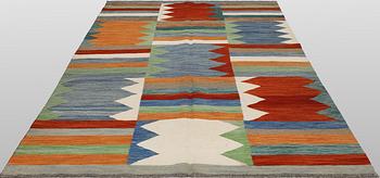 A Kelim carpet, c. 242 x 178 cm.