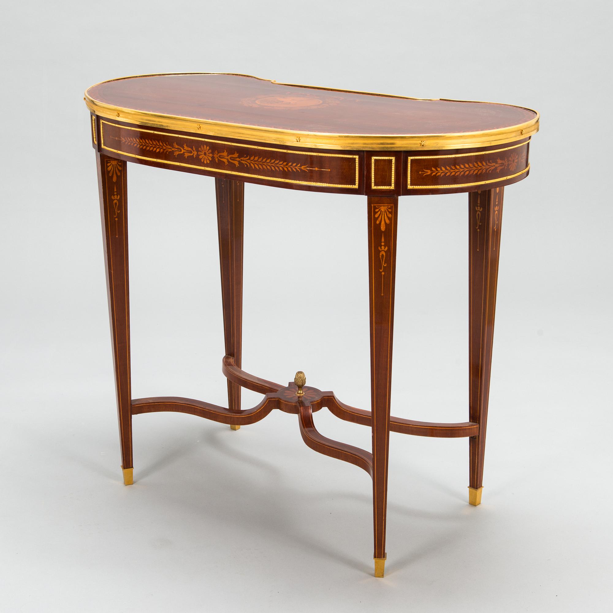 A Directoire style marquetry table from around year 1900.