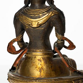 A gilt copper figure of Amitayus, Tibeto-Chinese, 18th Century.