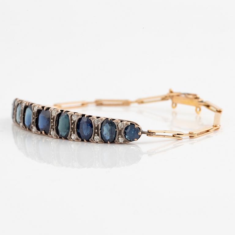 Bracelet 14K gold with dark sapphires and old-cut diamonds.