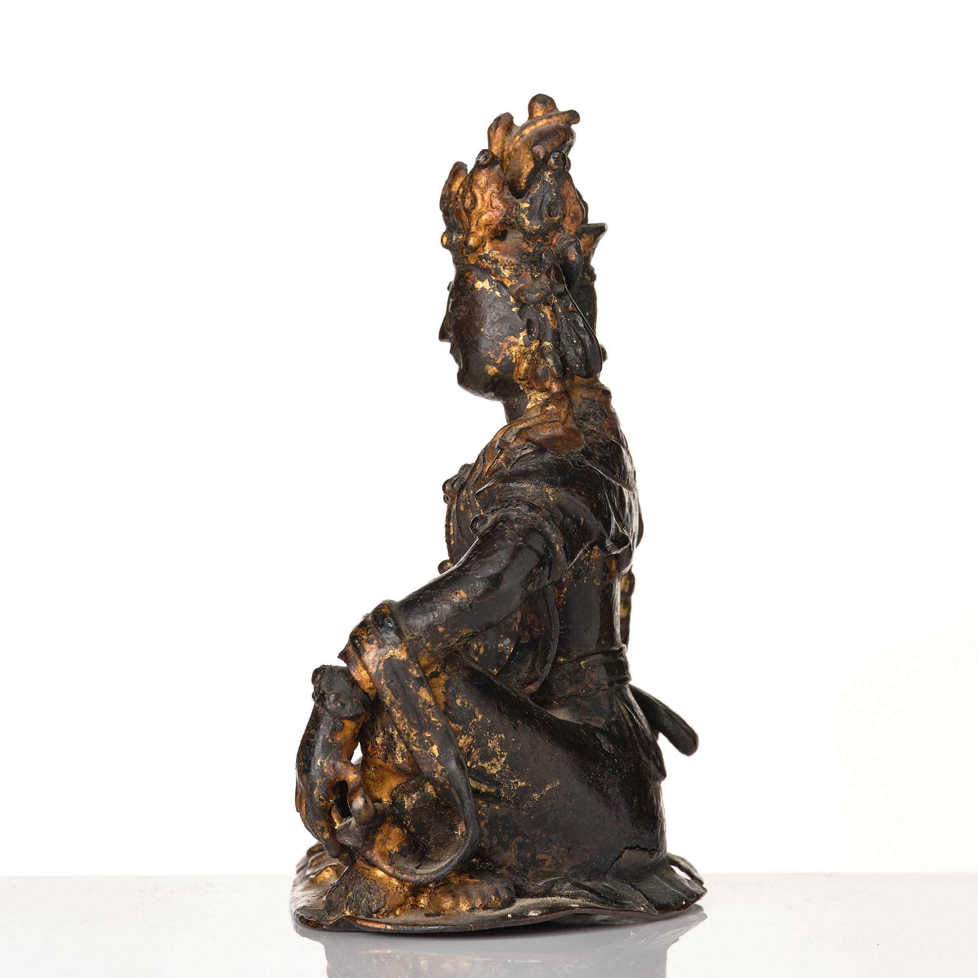A cold gilt bronze figure of Avalokitshvara, Ming dynasty.