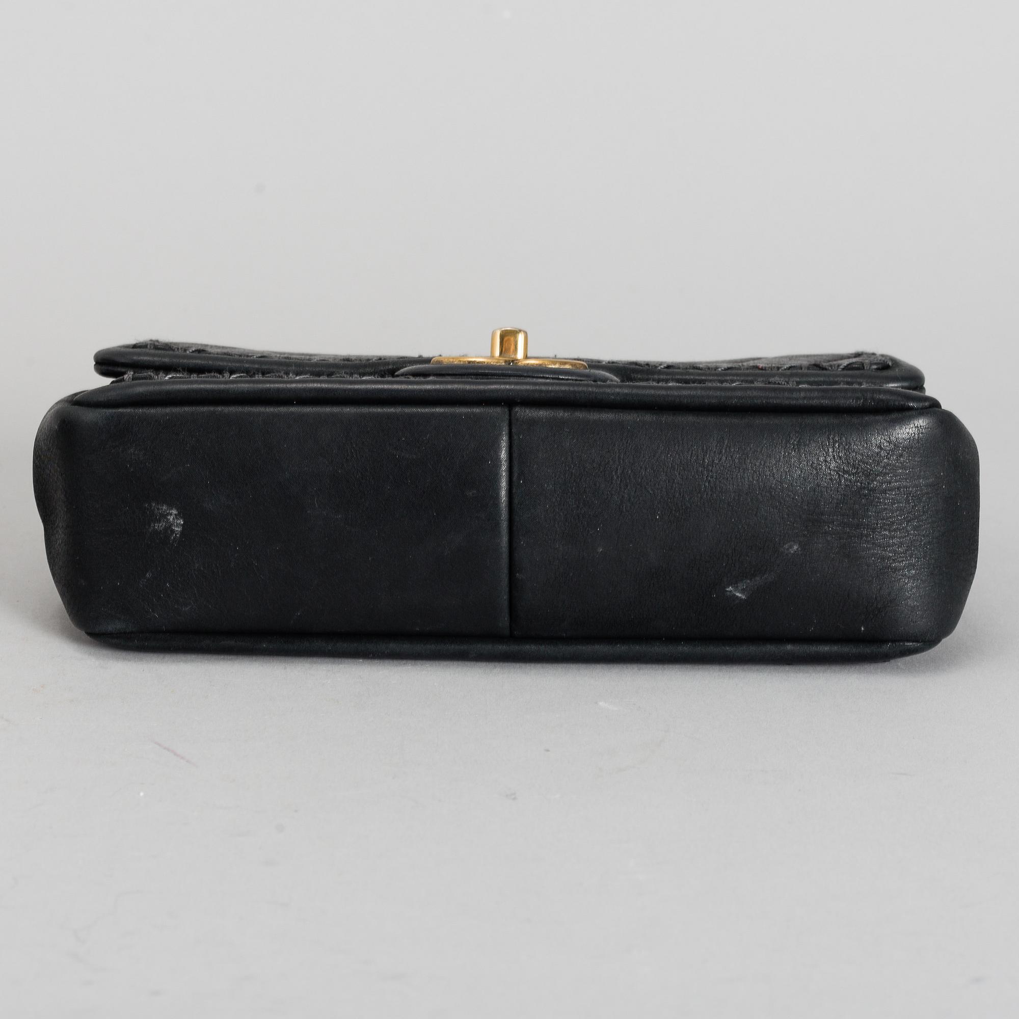 CHANEL, a black quilted fabric 'Flap Bag', 2015-2016.