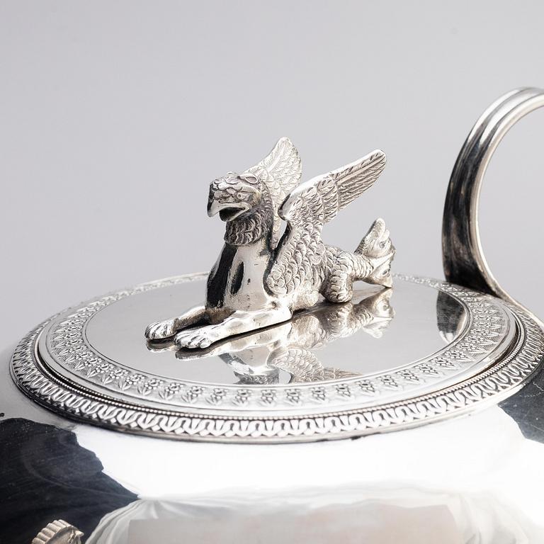 A silver pitcher with lid, unidentified maker LH, 19th century.