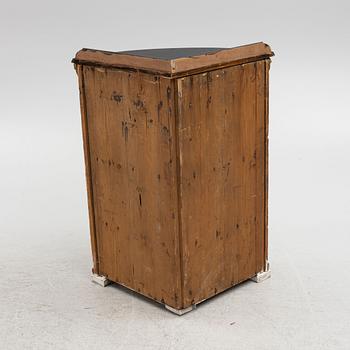 A corner cabinet, 19th Century.