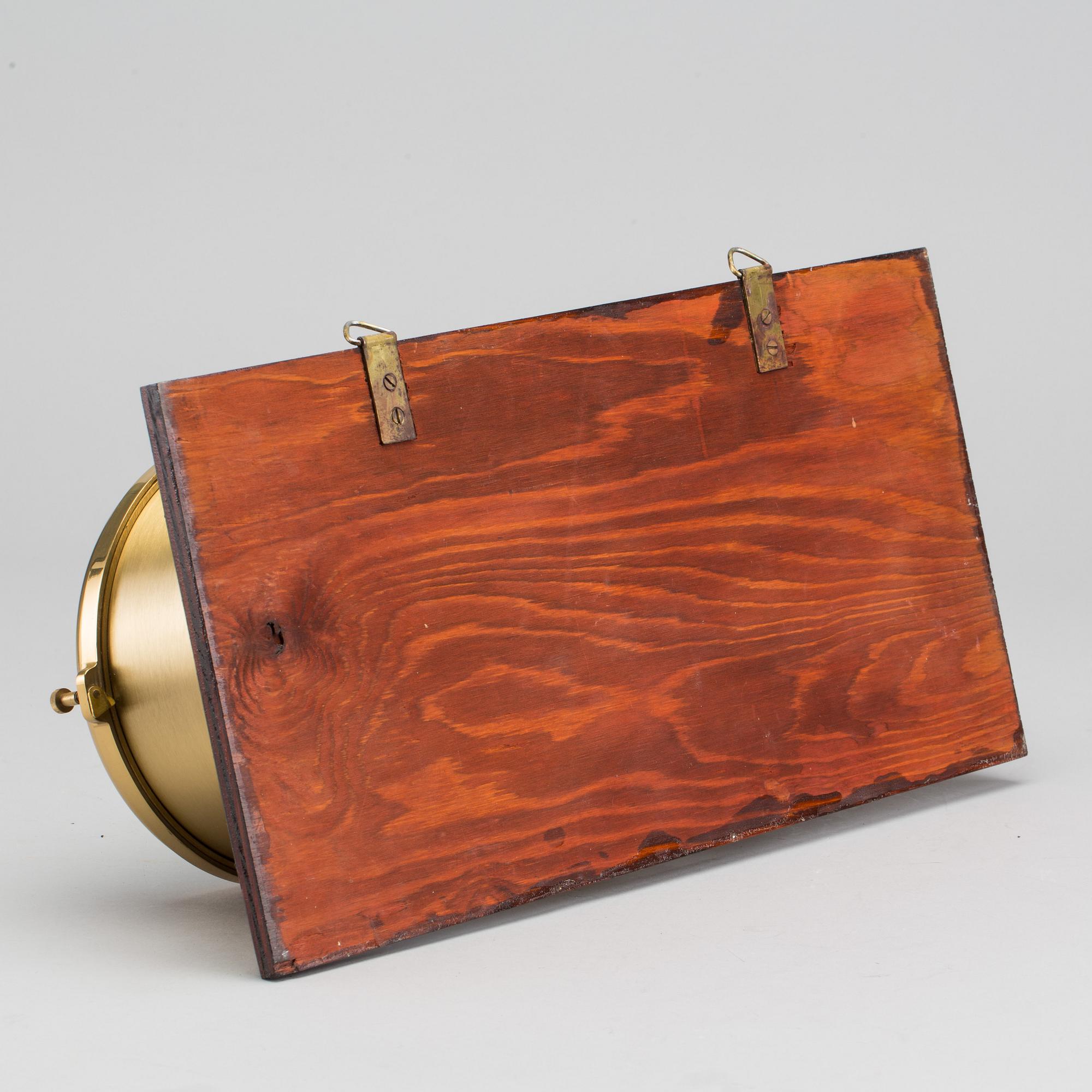 A BRASS MARINE CLOCK AND BAROMETER BY STOCKBURGER.
