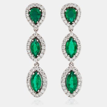 1177. A pair of emerald and brilliant-cut diamond earrings. Total carat weight of emeralds 4.27 cts, and diamonds 2.33 cts.