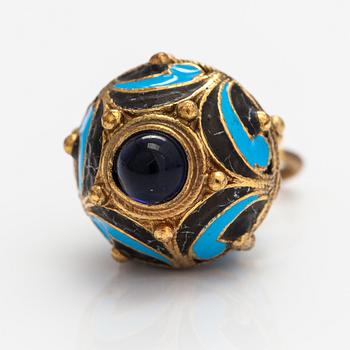 A gilded brass pendant with enamel and glass stones.