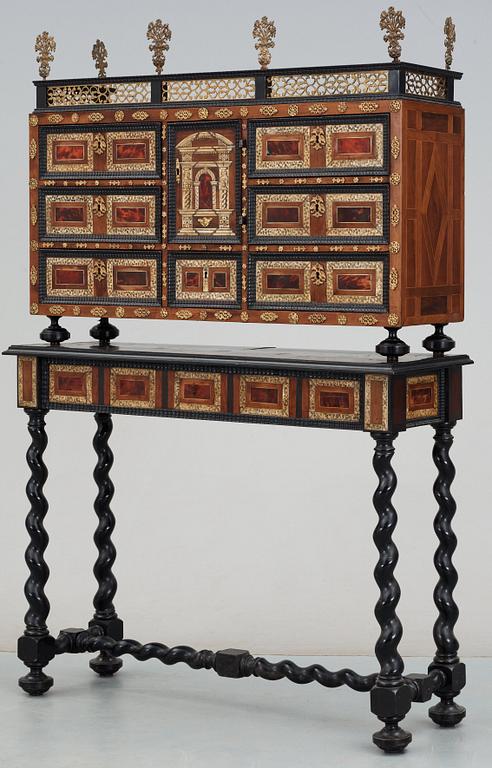 A Baroque 17/18th century cabinet, on later stand.
