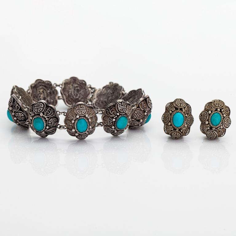 A bracelet and pair of earrings in silver with turquoises. Import marked Risto Aho, Helsinki 1964.