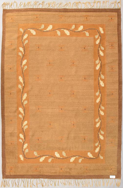 A 1920s Finnish flat weave carpet probably for Kotiteollisuus Oy Orkamo. Circa 340x245 cm.