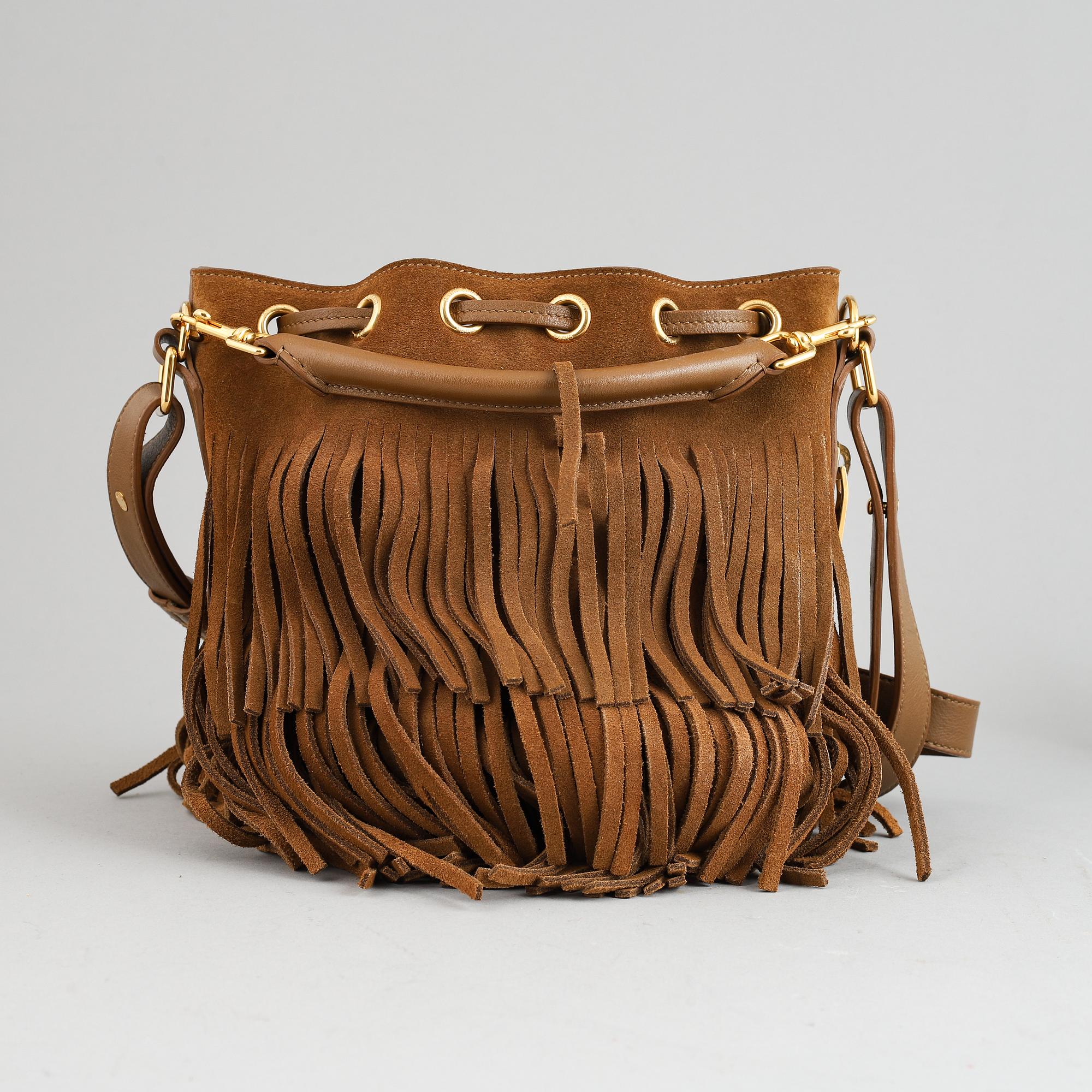 Yves Saint Laurent, a suede fringe handbag.