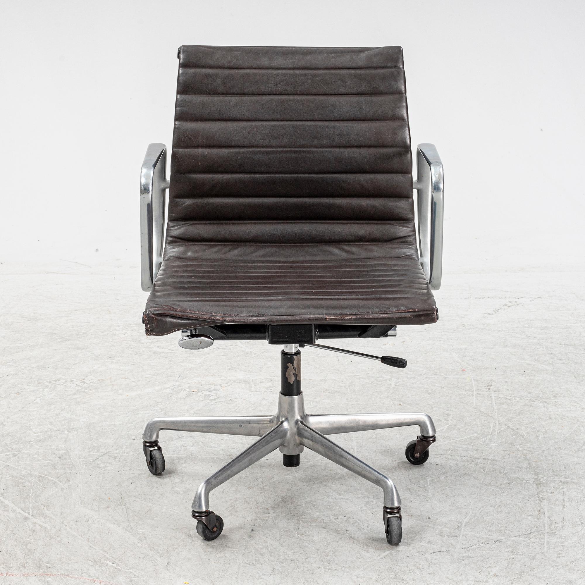 An EA 118 swivel office chair by Charles and Ray Eames for Herman Miller.
