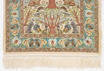 A figural silk Hereke rug, c 65 x 47 cm.