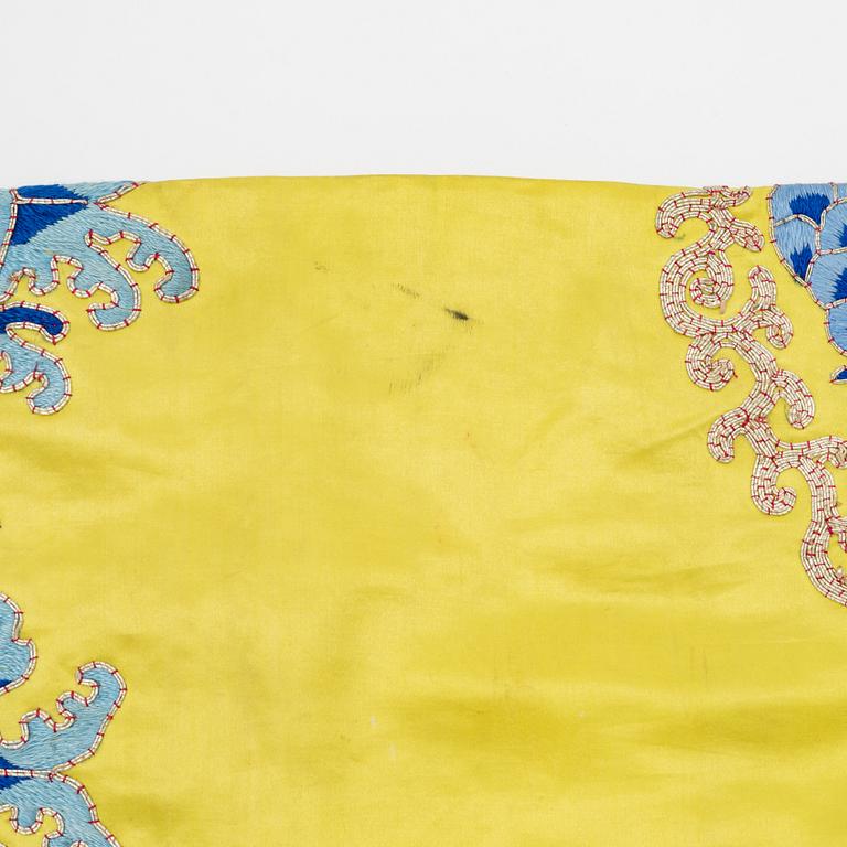 A yellow-ground embroidered silk robe, 20th century.