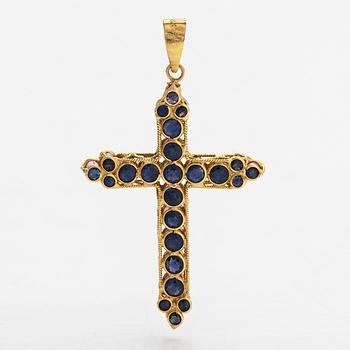 An 18K gold cross pendant with sapphires. Finnish import marks.