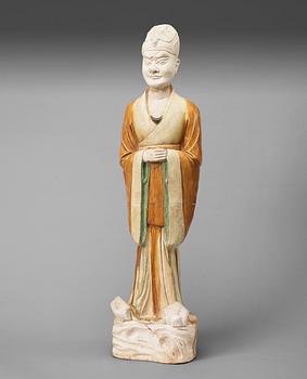241. A potted, partially glazed tomb figure of a guardien, Tang dynasty (618-907).