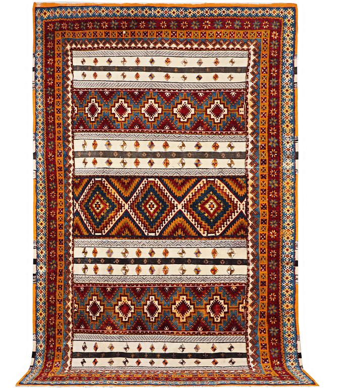 A North African carpet, c. 318 x 193 cm.