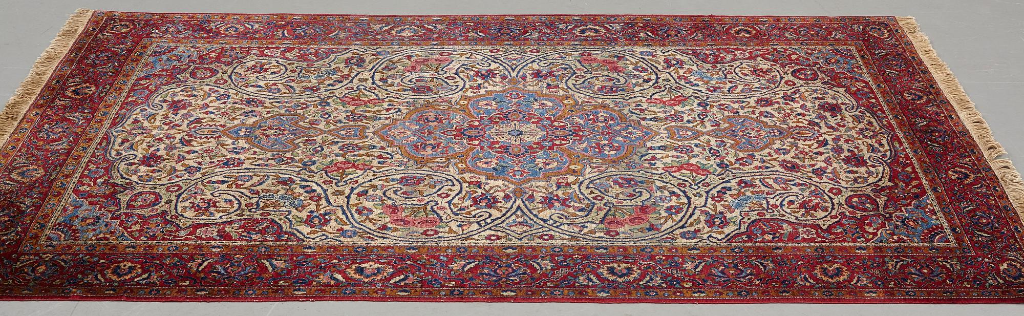 Matto, a semi-antique silk Kashan, ca 212,5-214,5 x 134,5-135,5 cm.