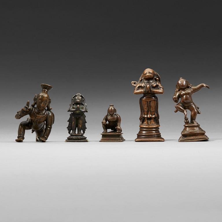 A group of five Indian copper alloy figures of hannuman and krisna, 18th Century and older.