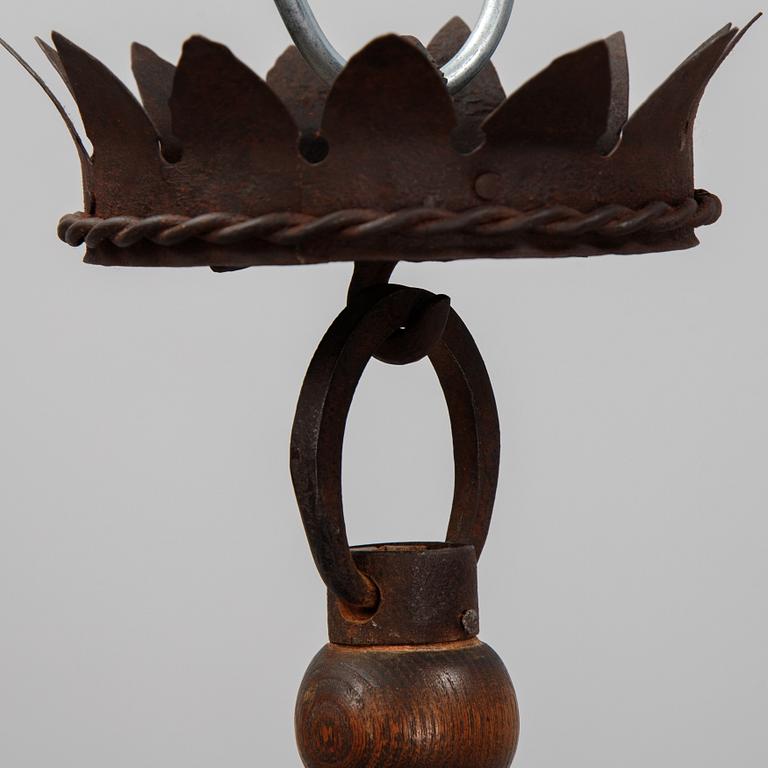An iron and oak chandelier, 20th Century.