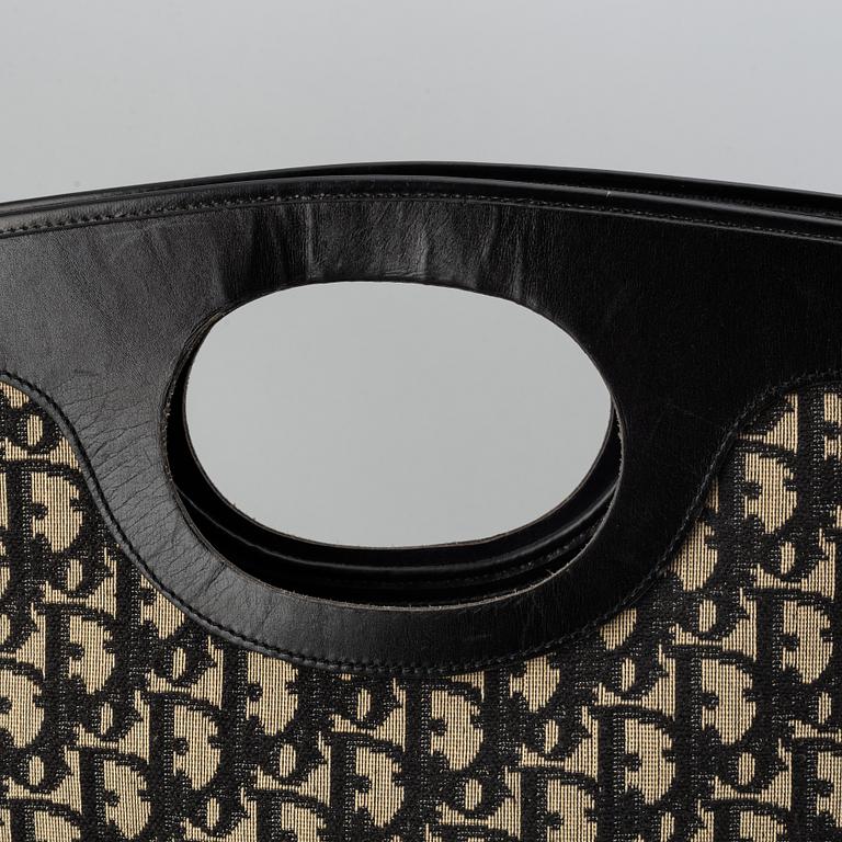 Christian Dior, Oblique fold-over convertible clutch.