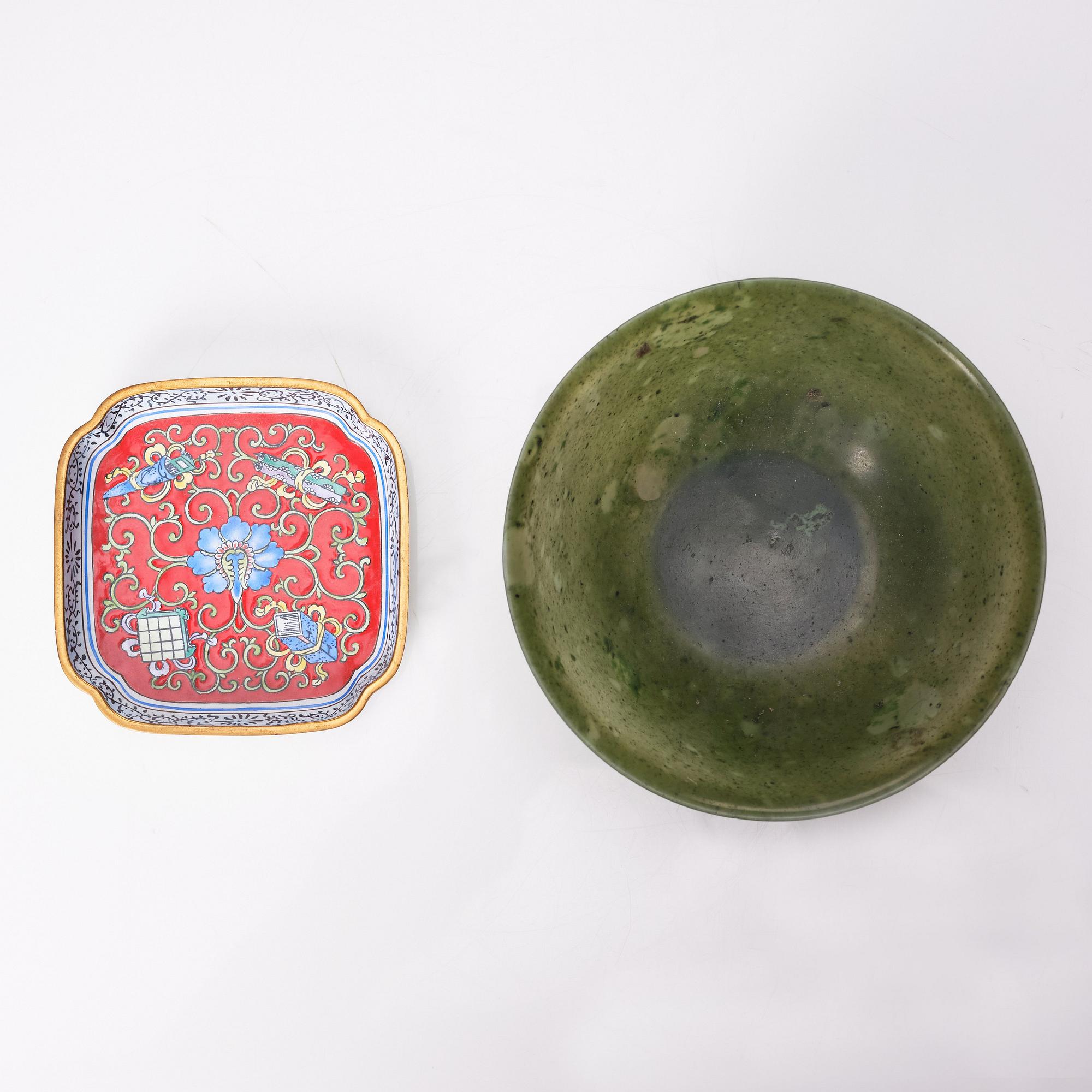 A Chinese enamel on copper coaster, a green stone bowl and a small stone figure, China, Qing dynasty and 20th century.