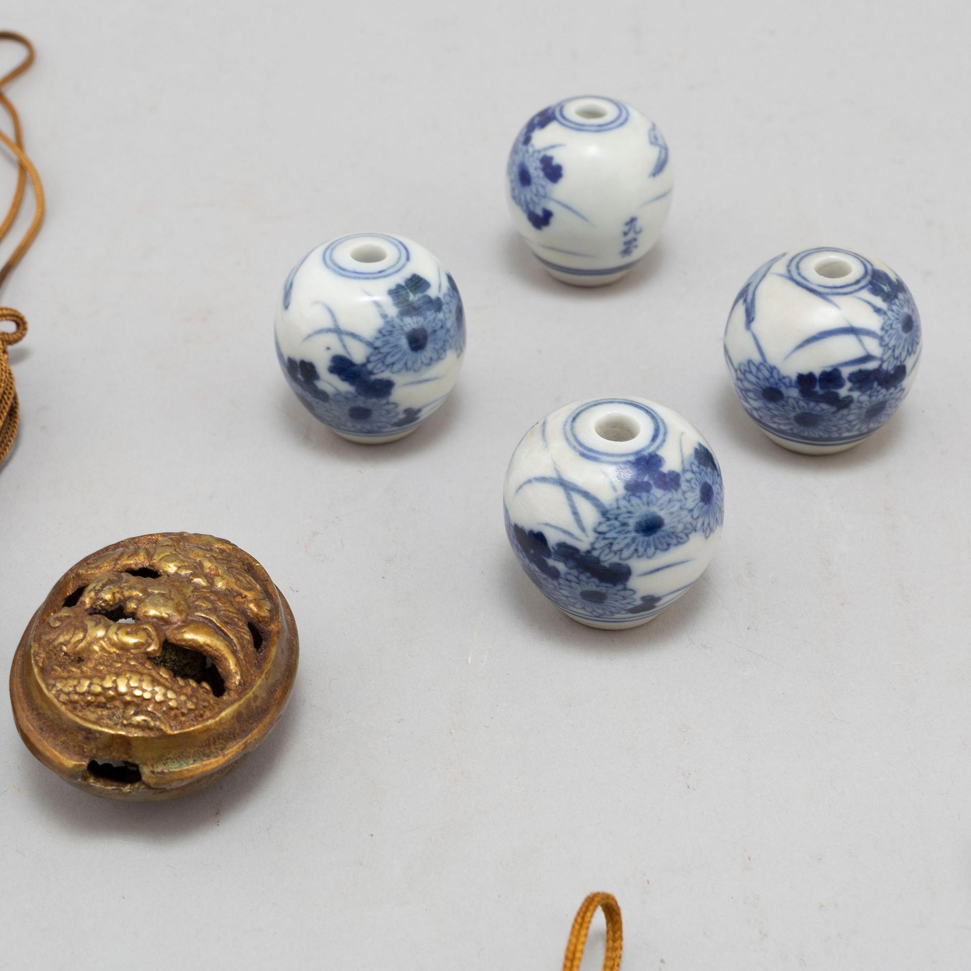 Eight (6+2) tassles, porcelain and bronze, Japan, 20th century.