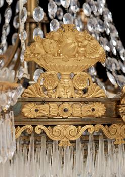 An Empire first half 19th century eighteen-light gilt bronze chandelier.