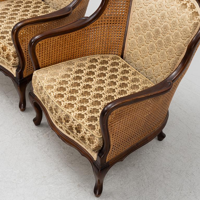 A pair of rococo style armchairs, first half of the 20th century.