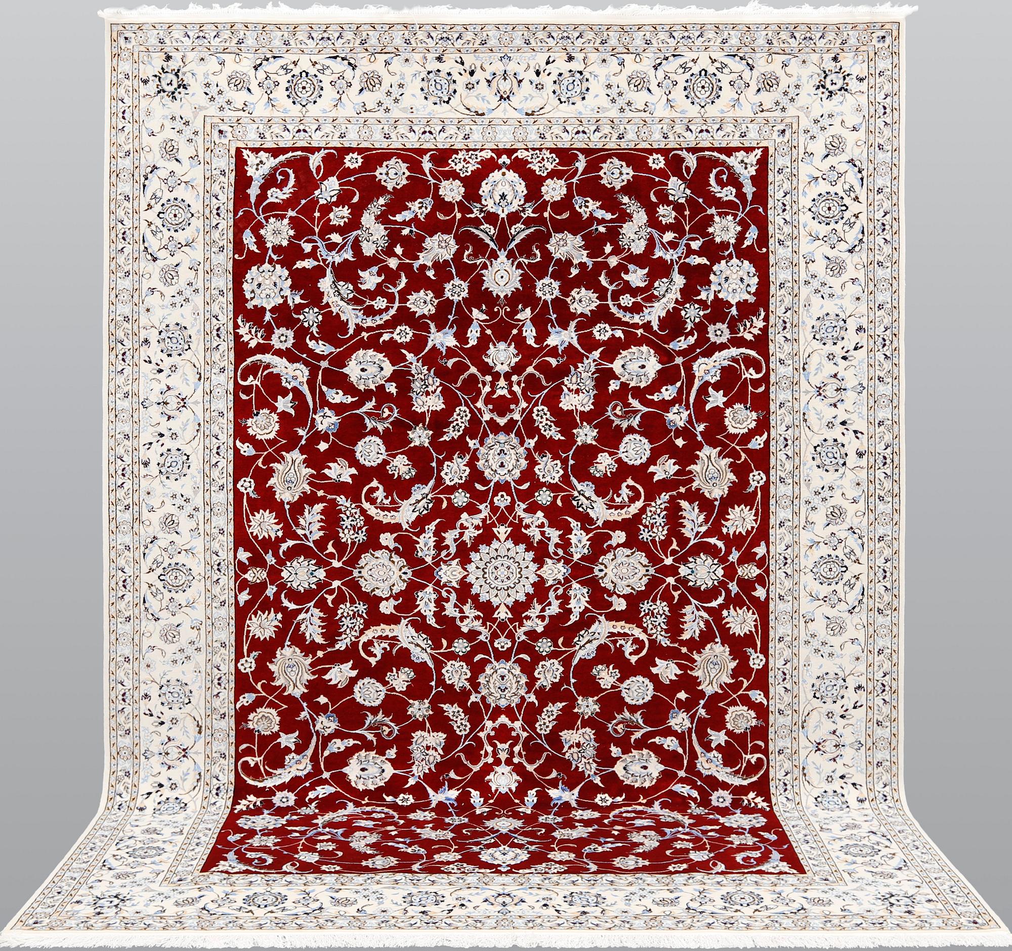 A Nain part silk carpet, 302 x 204 cm.