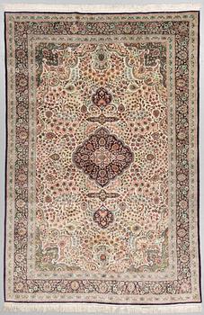 An orietal silk carpet, around 273 x 180 cm.