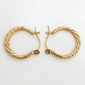A pair of 14K gold earrings.