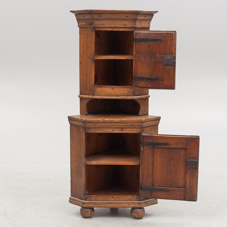 A provincial corner cabinet, early 19th century.