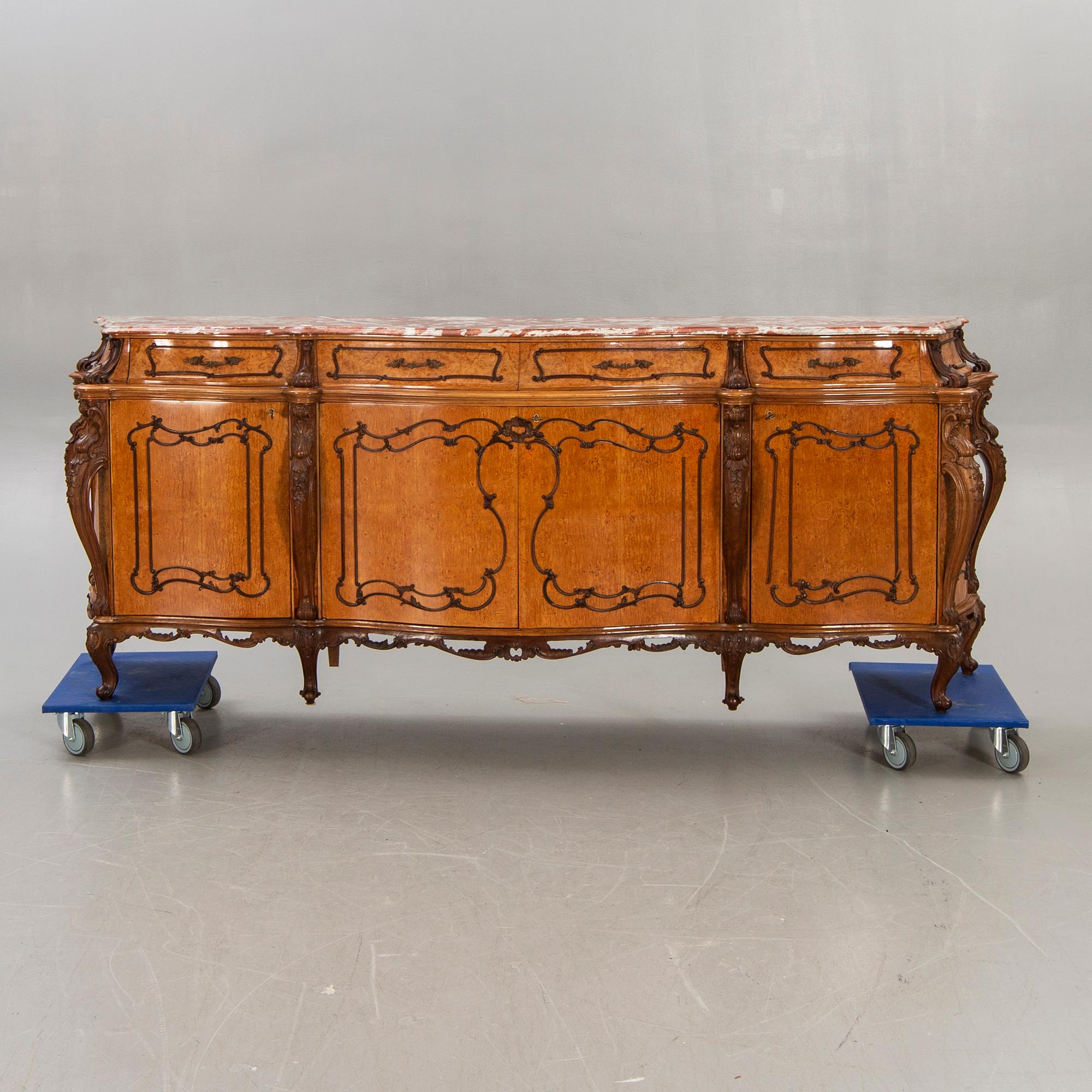 A Louis XV style birch sideboard first half of the 20th century.