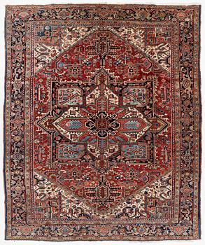 A semi-antique Heris carpet, c. 364 x 299 cm.