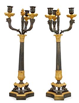1026. A pair of three-light candelabra, late Empire-style.