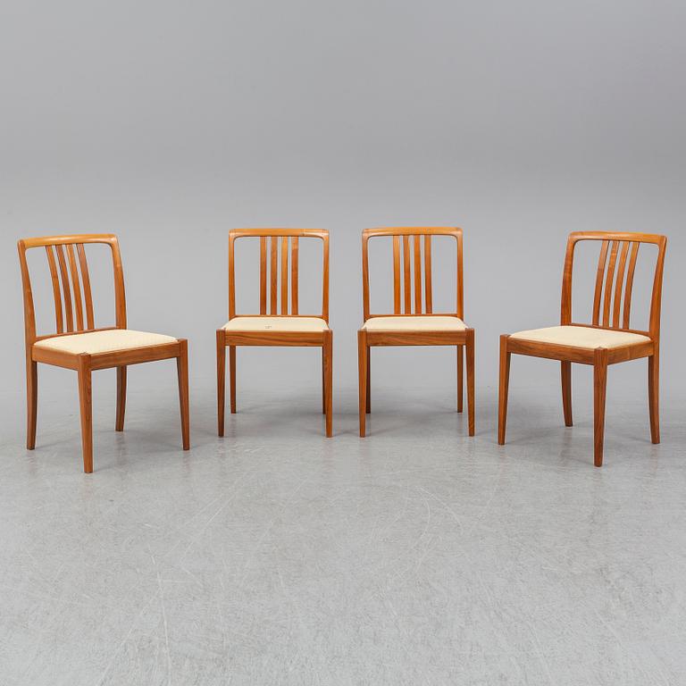 A 1950/60s teak and valnut table and four chairs.