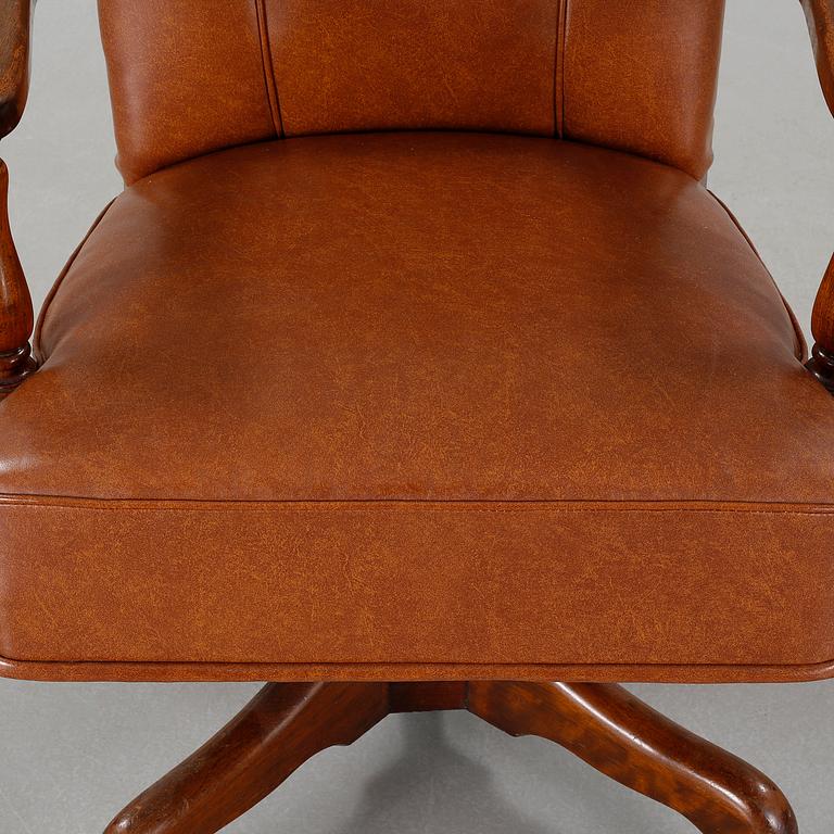 A desk chair from The Marble & Shattuck Chair Company in Ohio, around the mid 20th century.