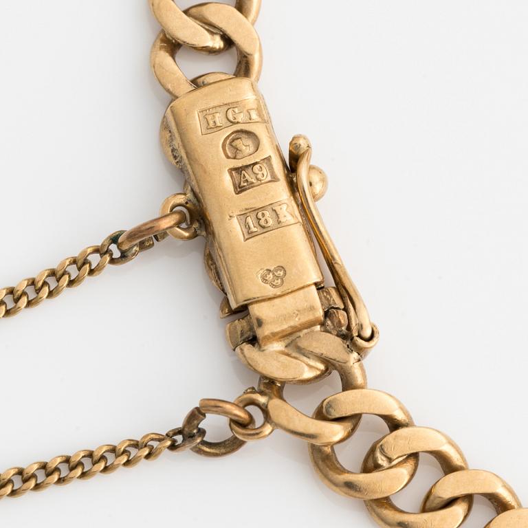 Armband 18k guld med berlocker.