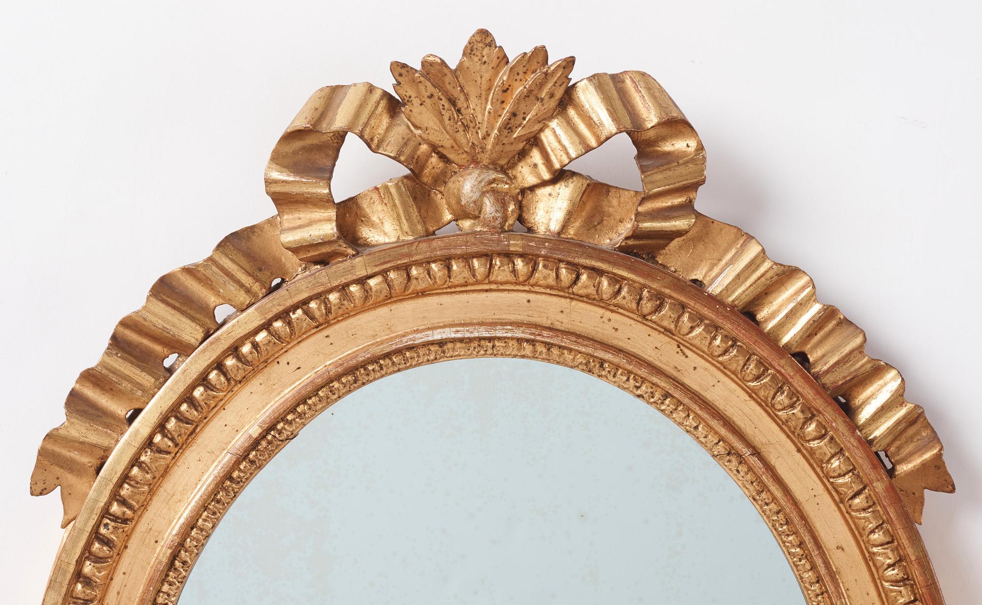 A pair of Gustavian giltwood one-branch girandoles, Stockholm, late 18th century.