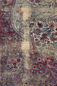 A semi-antique Kerman carpet, c. 325 x 203 cm.