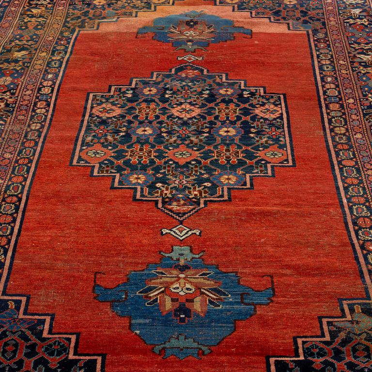 AN ANTIQUE BIDJAR CARPET, CA 374 X 224 CM.