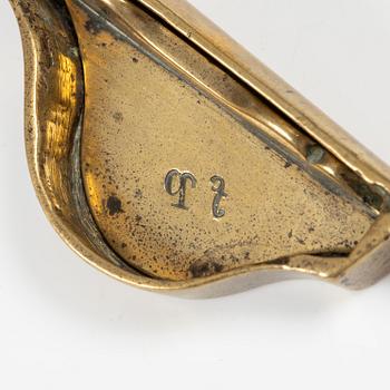 A Swedish/North European baroque brass wick snuffer and tray, circa 1700.