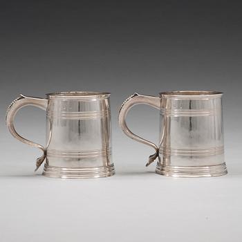 A pair of English early 18th century silver muggs, mark of John Cory, London 1704.